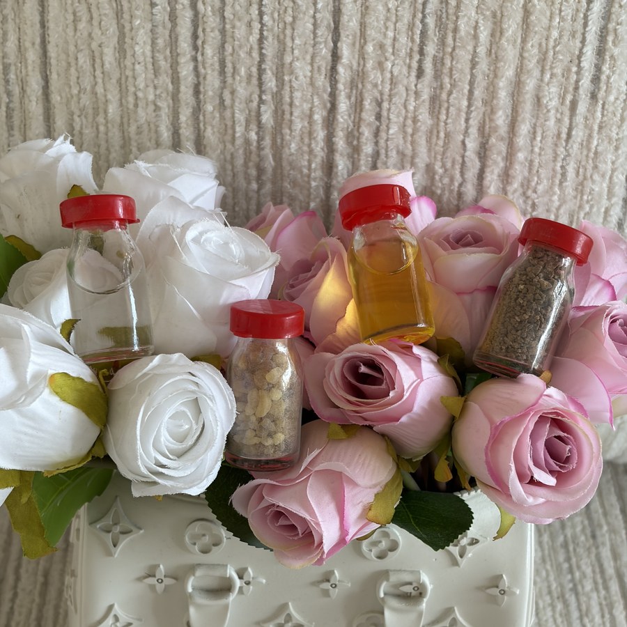 Close-up of the holy water, incense, oil, and soil vials