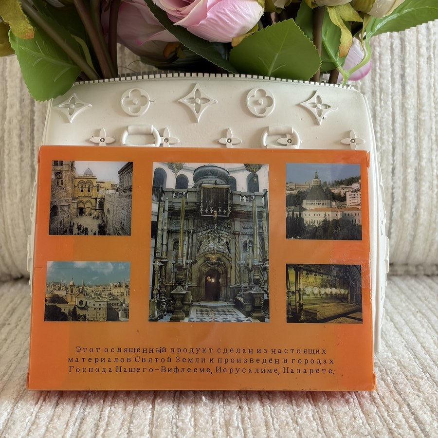 Back of the Holy Sepulchre box showing authenticity details and holy site photos