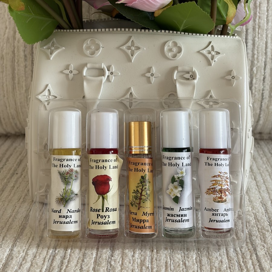 Close-up of all five anointing oil roll-on bottles